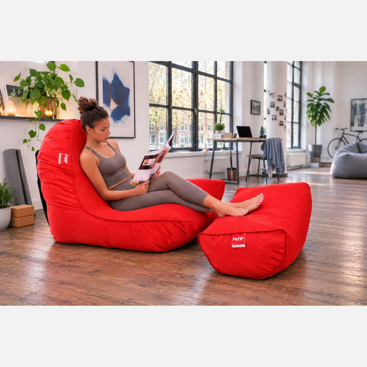 Street Cred Red AirMesh sofa and ottoman in a bright loft living room